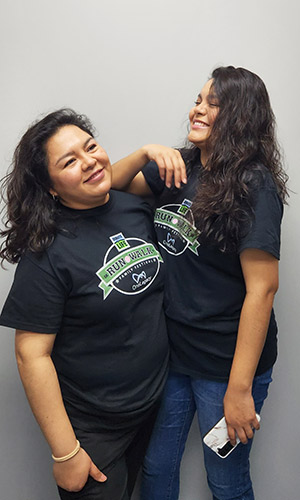 Nadia Morales, left, who donated a kidney to her sister, Xenia Morales, right, clown around in Donate Life t-shirts on National Donor Day, Feb. 14, 2023.