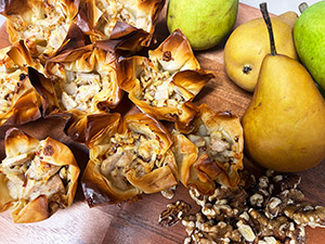 Pear and gruyère cheese are a perfect marriage in these phyllo dough tarts topped with walnuts and honey.