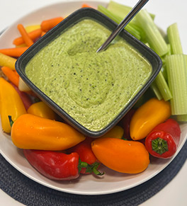 White bean, spring pea and roasted shallot dip with baby peppers, celery and carrots. 