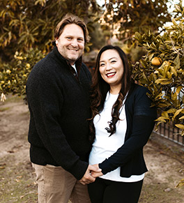 Ovarian cancer survivor Megan Yoo Schneider, pictured with her husband, is on a mission to raise awareness and funding for cancer research at the UCI Anti-Cancer Challenge.