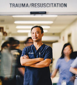 UCI Health trauma nurse Thien (Tim) Do stands just outside the busy emergency department at Douglas Hospital.