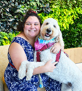 Nikki Daurio and her service dog, Tiki, having a hug.