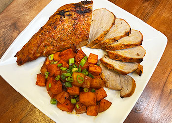 Gochujang Pork Tenderloin and Roasted Vegetables served on a white platter.