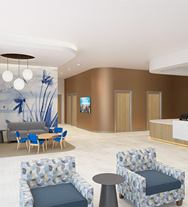 A lobby view of the Center for Autism and Neurodevelopmental Disorders shows soothing enviroment with blue colors.