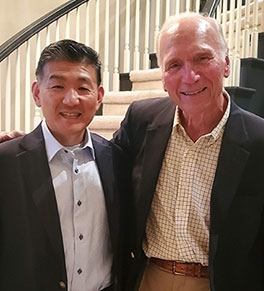 UCI Health pediatric eye specialist Dr. Donny Suh to lead fellowship program endowed by his mentor, Dr. John Graether, at right.