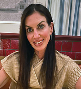 Heather Austin sitting in a restaurant, happy and pain free once again.