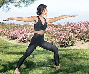 Before minimally invasive spine surgery, yoga exercises like this lunge pose were too painful for Heather Austin.