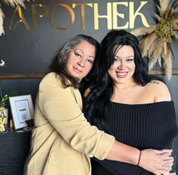 Kat Kitchen, left, hugs daughter Jessica Feldman at the opening Feldman's Newport Beach facial spa. 