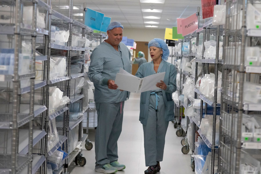 uci health vice president of perioperative services mara rosalsky walks with a colleague in the aisles of the new surgical supplies room on the surgical mgafloor at uci health irvine