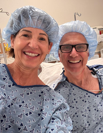 uci health dr cameron ricks and his wife michelle malchiodi in their gowns and caps for a colonoscopy together