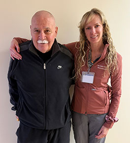 UCI Health patient Robert Cavazos, left, poses with his neurosurgeon, Dr. Michelle Paff, after he underwent a focused ultrasound procedure to treat tremors in his right hand.