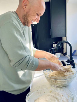 uci health kidney donor chris checchio making sourdough bread at home in his kitchen