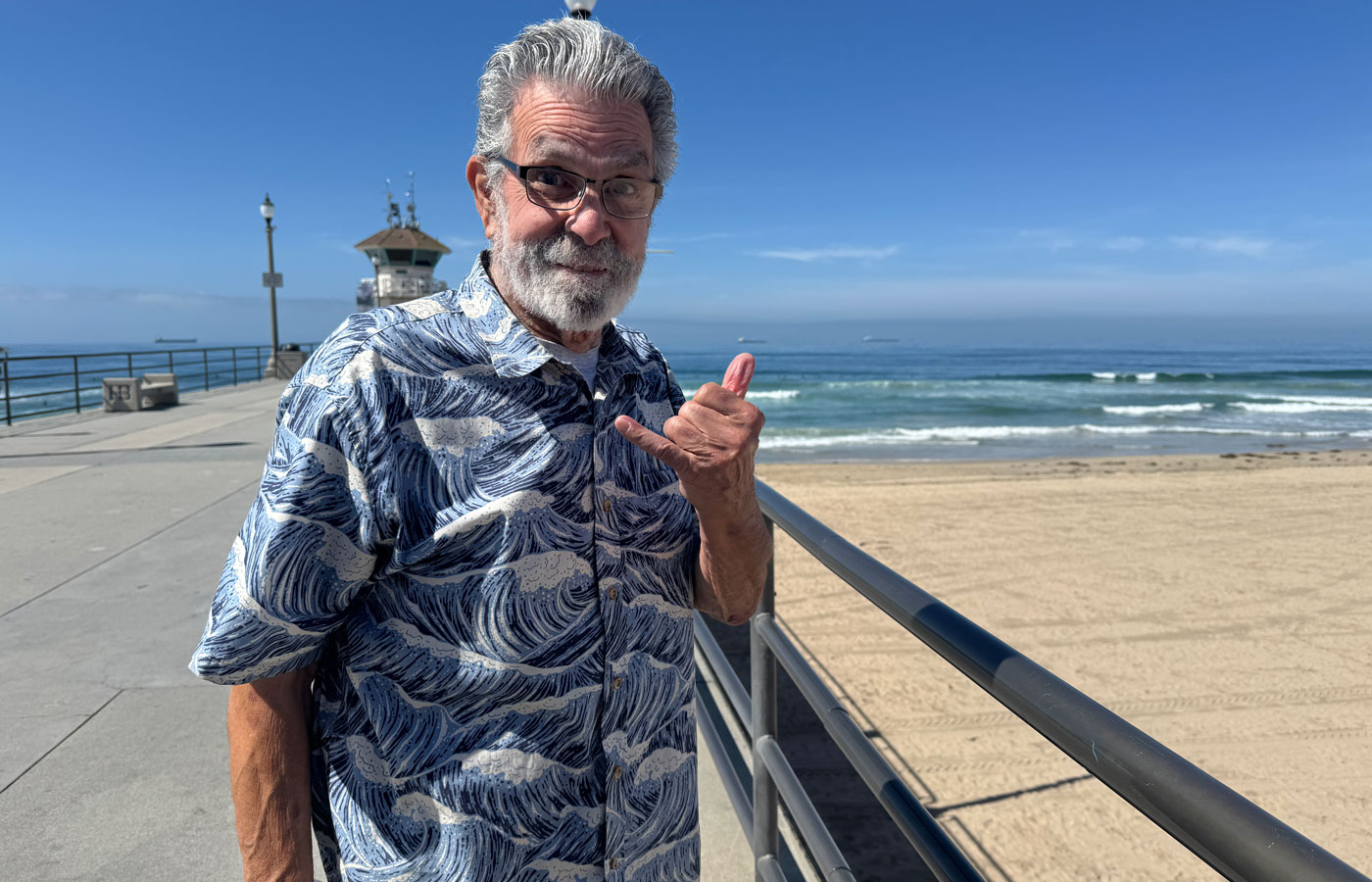 bob "the greek" bolen on the huntington beach pier on a sunny day