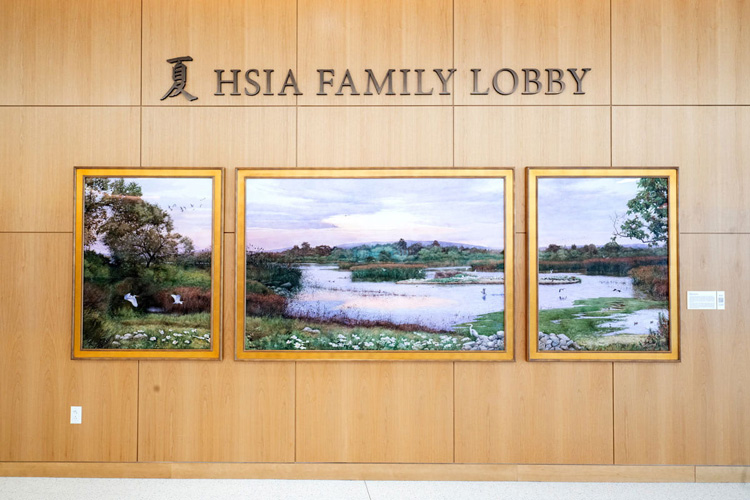 a painting in the hsia family lobby at the joe c wen and family center for advanced care. the painting is called marshland symphony and is a painting of a marsh scene