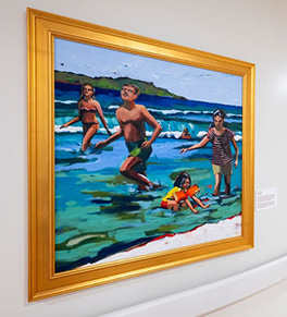 The painting "Day at the Beach," by Laguna Beach artist Brenda K. Bredvik shows a man, woman and two children playing joyfully in the ocean.