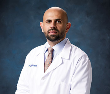 A portrait of UCI Health urologist Dr. Mohammed Shahait wearing a white clinical coat