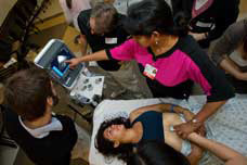 Students from all over California learn hand-held ultrasound techniques at UltraFest 2012, training on both human subjects and lifelike mannequins. Photo: Peter Huynh / University Communications