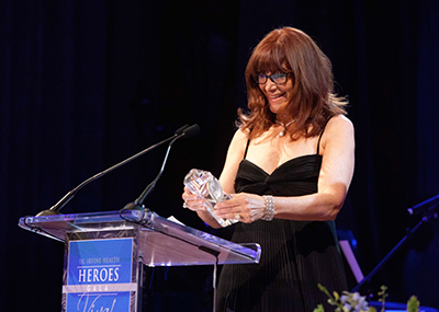 Susan Samueli, founder of the UCI Health Susan Samueli Center for Integrative Medicine, accepts the Hero award at the 2015 UCI Health Heroes gala.