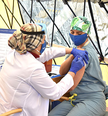 Respiratory therapist Vita Susin was the first to receive a COVID-19 vaccination at UCI Health