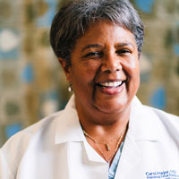 uci health maternal fetal medicine specialist carol major in white coat, major spoke to bloomberg about the maternal health crisis affecting black women in particular