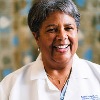 uci health maternal fetal medicine specialist carol major  in white coat, major spoke to bloomberg about the maternal health crisis affecting black women in particular