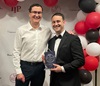 uci health trauma surgeon Jeffry Nahmias right, with Dr. Elliot Silver, chief surgical resident and future trauma and critical care fellow with UCI Health and UCI School of Medicine, holding the Heroes with Heart Gala Marianne Cinat MD Memorial Award in front of white black and red baloons
