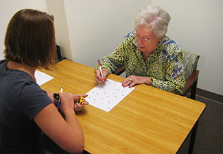 Older woman takes timed cognition test as part of the UC Irvine 90+ Study