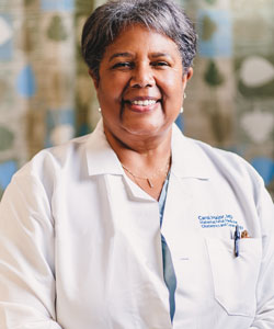 uci health maternal fetal expert carol major wearing white coat and smiling, major talked to yahoo about the rising maternal death rate in the united states
