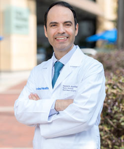 uci health otolaryngologist hamid djalilian standing outside in white coat and blue tie arms crossed djalilian spoke to healthline about hearing damage as one ages