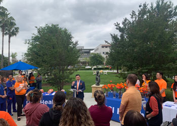 uci health chief operating officer Nathan Shinagawa addressed coworkers at its national gun violence awareness day event
