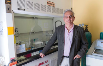 uci center for the study of cannabis director daniele piomelli in his laboratory in front of a sink with his hand in one pocket; piomelli says the amount of cannabidiol of CBD water is unlikely to be of benefit