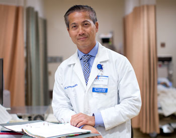uci health bariatric surgeon dr ninh nguyen wearing a white coat and badge in observation area; nguyen spoke to everyday health about lisa marie presley's death years after weight loss surgery