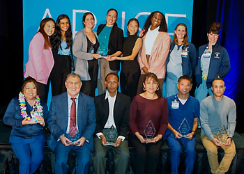 uci health ariise award winners stand in two rows holding their awards