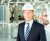Dr. Richard Van Etten, director of the UCI Health Chao Family Comprehensive Cancer Center, wears a hard hat during a visit to the new cancer center under construction in Irvine.