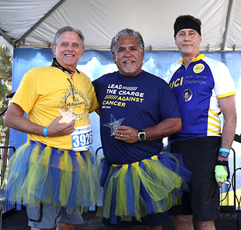 Melanoma specialist Dr. James Jakowatz, left, skin cancer patient James Madrid, center, pose with UCI Anti-Cancer Challenger founder Dr. Richard Van Etten.