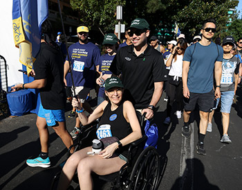 Bile duct cancer patient Neusha Raffijandi, in chair, gets a push from husband Anka in the race to defeat cancer.