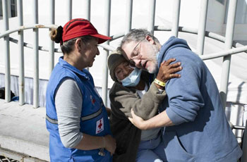 An older adult woman who had never seen a physician in her life hugs Dr. Cristobal Barrios Jr. of UCI Health during his humanitarian visit to Ecuador last year. Angelo Di Fusco