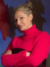 uci health dermatologist dr natasha mesinkovska wearing a black and red long-sleeve with arms crossed