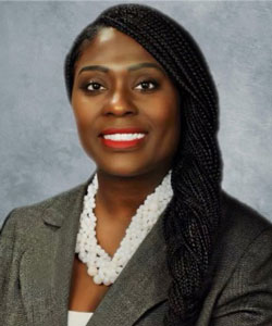 image of uci health clinical coordinator joy white in studio wearing brown jacket and white shirt