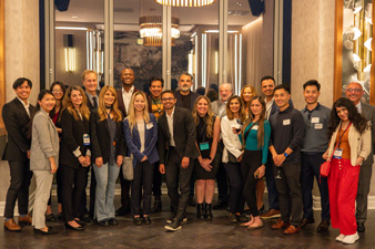 UCI Health cancer specialists and co-workers smile and pose for a photo during a reception at the American society of clinical oncology conference in chicago