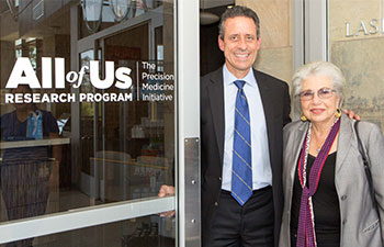 Dr. Michael Stamos, dean of UC Irvine School of Medicine and Professor Hoda Anton-Culver stand in the doorway of the All of Us Research Program offices.