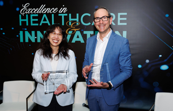 uci health infectious disease expert dr susan huang and chief medical officer and senior vice president joseph carmichael holding their awards at the greater irvine chamber of commerce excellence in healthcare awards