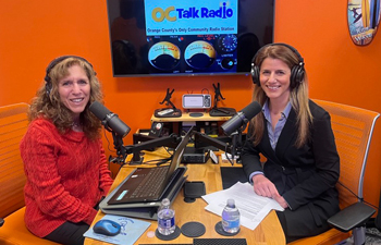 uci heath cardiologist dr ailin barseghian sitting in the studio next to a microphone with OC talk radio host