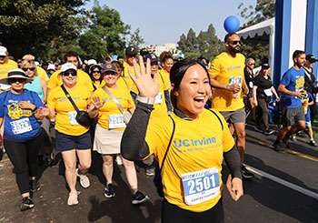 Runners and walkers approach the finish line at the 2024 UC Irvine Anti-Cancer Challenge.
