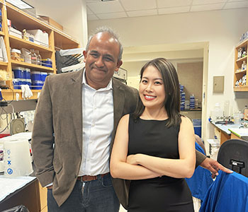 UCI Health melanoma researcher Anand Ganesan, MD, PhD, is pictured at left in the Ganesan lab with graduate student and scientist Hui Xiao, PhD.