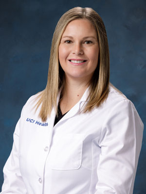 uci health psychiatrist dr. kathryn lunny wearing a white coat with a blue studio background