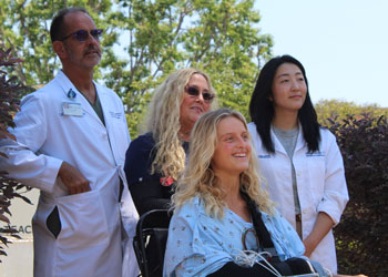 uci health patient elieah boyd with her care team as she speaks to the media after her discharge from UCI medical center