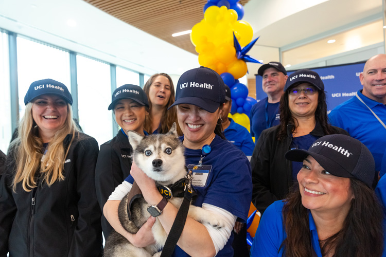 uci health team members pose with pixel a uci health therapy dog at the community unveiling of the uci health — irvine acute care hospital on saturday november 15