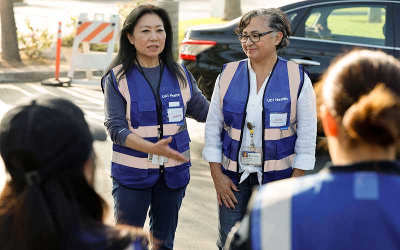 uci health family health center anaheim car seat program safety team members discuss how to properly install a car seat