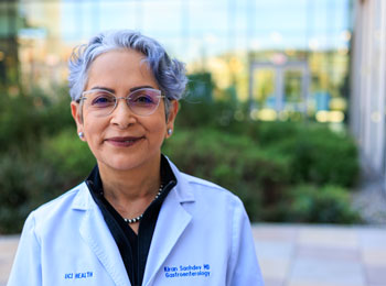 uci health gastroenterologist dr. kiran sachdev outside wearing a white coat